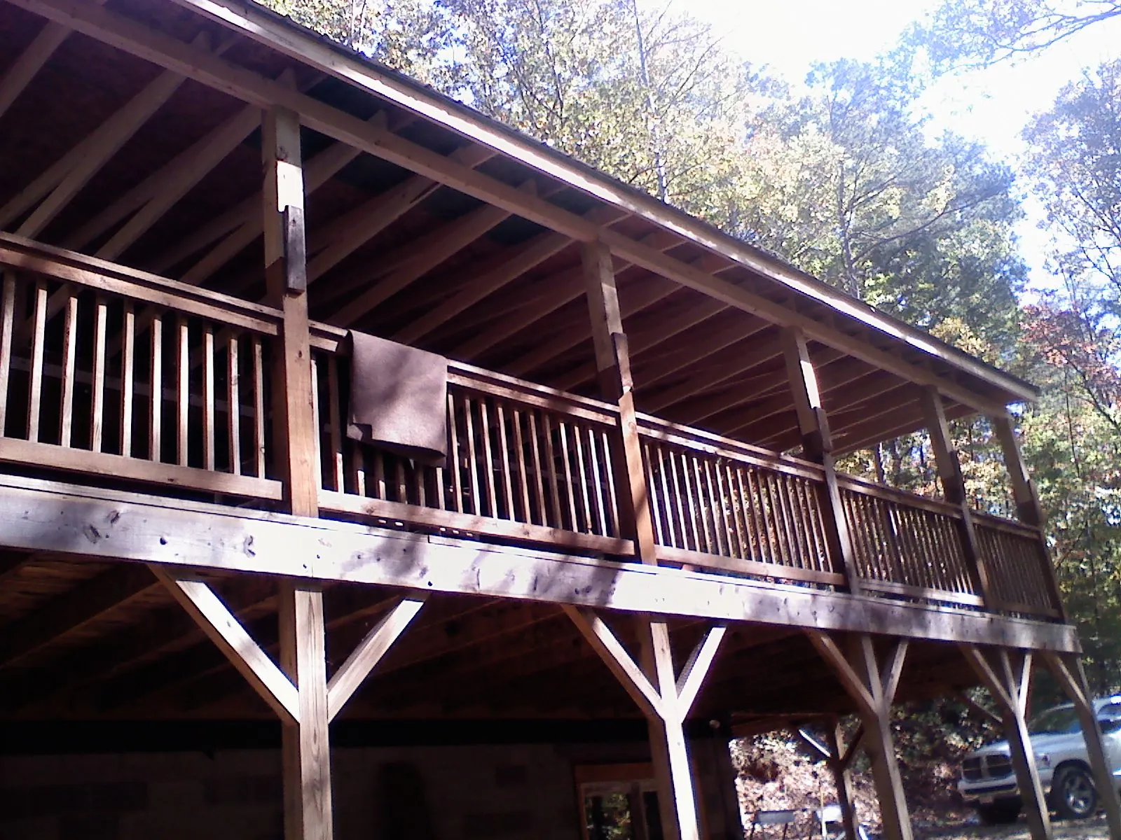 Timber framing under a new elevated porch and deck — Roof Leak Repair in Hye by Roofing Brothers